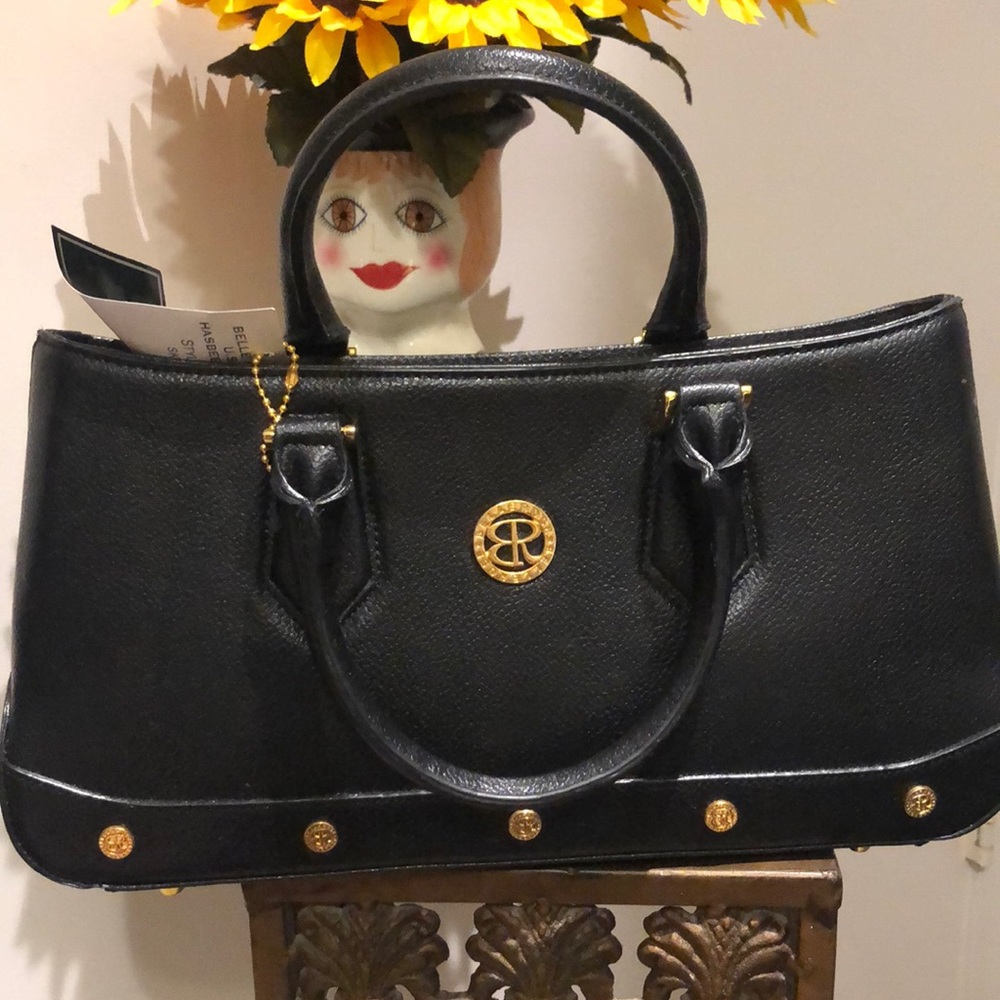 Cute  black small tote bag with a Crossbody strap inside.